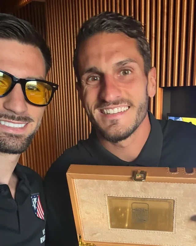 Koke y Álex Baena